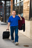 18069 Jeff Beuhl with suitcase